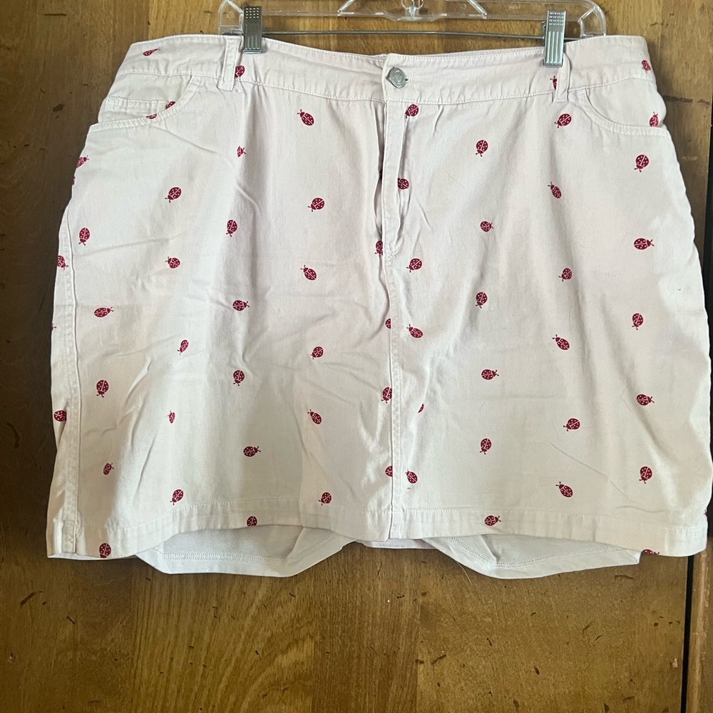 Woman Within White Skort with Red Ladybug Accent